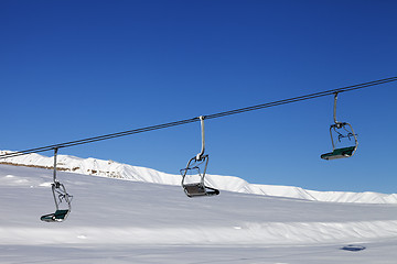 Image showing Chair-lift and blue sky at sun day