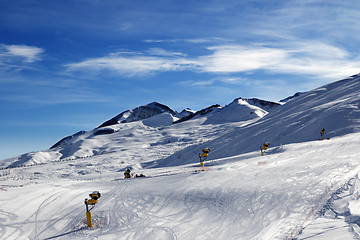 Image showing Ski slope with snowmaking at sun morning