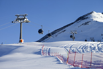 Image showing Gondola lift on ski resort at sun day