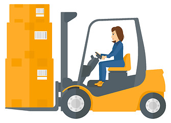 Image showing Worker moving load by forklift truck.