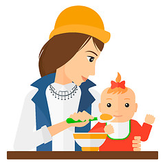 Image showing Woman feeding baby.