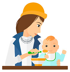 Image showing Woman feeding baby.