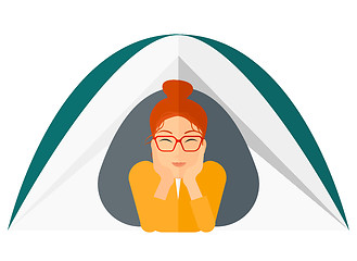 Image showing Woman lying in tent.