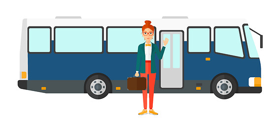 Image showing Woman standing near bus.