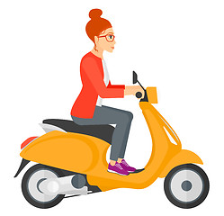 Image showing Woman riding scooter.