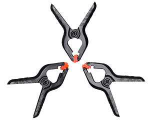 Image showing Plastic black-orange clamps on white