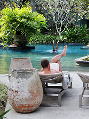 Image showing Relaxing by the pool