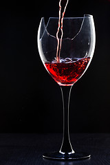 Image showing Red wine pouring