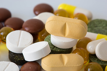 Image showing Pile of various colorful pills isolated on white