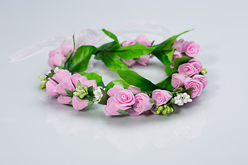 Image showing tiara of artificial  roses on a light background