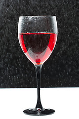 Image showing glass with red wine. splashing water