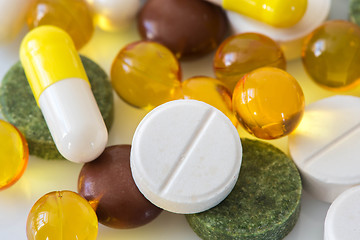 Image showing Pile of various colorful pills isolated on white