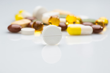 Image showing Pile of various colorful pills isolated on white