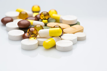 Image showing Pile of various colorful pills isolated on white