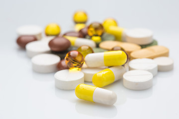 Image showing Pile of various colorful pills isolated on white