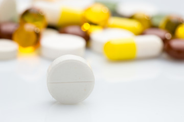 Image showing Pile of various colorful pills isolated on white