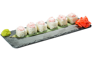 Image showing set of sushi on black slate substrate, isolated white background