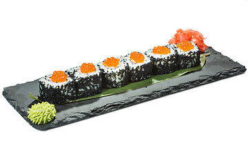 Image showing set of sushi on black slate substrate, isolated white background