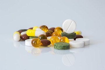 Image showing Pile of various colorful pills isolated on white