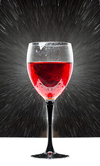 Image showing glass with red wine. splashing water