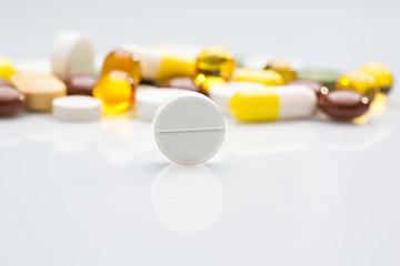 Image showing Pile of various colorful pills isolated on white