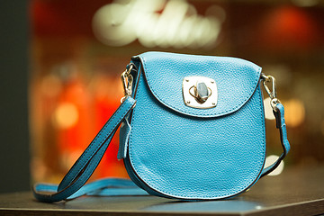 Image showing blue bag on a shelf in the store