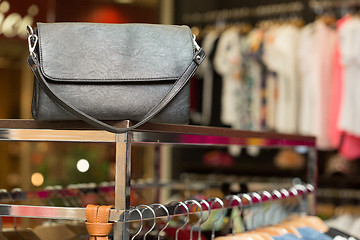 Image showing black bag on a shelf in the store