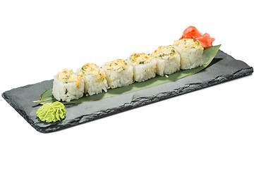 Image showing set of sushi on black slate substrate, isolated white background