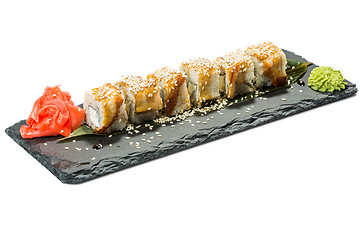 Image showing set of sushi on black slate substrate, isolated white background