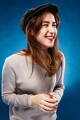 Image showing The happy laughing girl on  blue background.