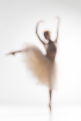 Image showing Blurred silhouette of ballerina on white background