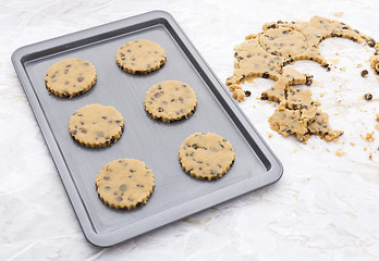 Image showing Six chocolate chip cookies on a baking tray