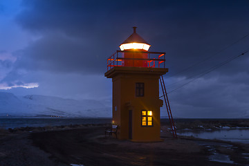 Image showing Orange lighthouse at night, Iceland