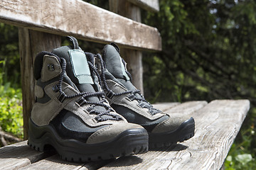 Image showing Grey hiking shoes on a bench