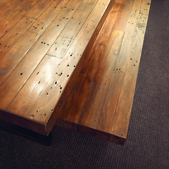 Image showing Massive wooden table and bench