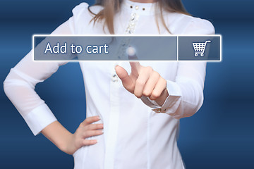 Image showing Businesswoman pressing add to cart button on virtual screens. 