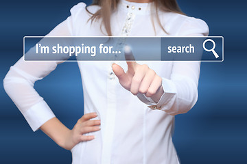 Image showing Woman click on virtual e-shop button. E-commerce and B2C concept. i shopping for