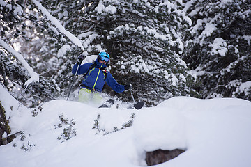 Image showing freeride skier skiing in deep powder snow