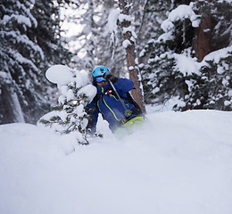 Image showing freeride skier skiing in deep powder snow