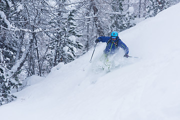 Image showing freeride skier skiing in deep powder snow