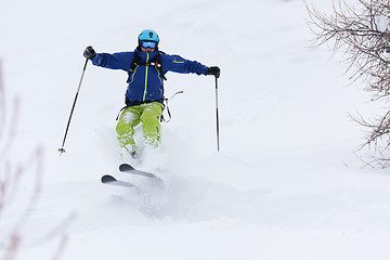 Image showing freeride skier skiing in deep powder snow