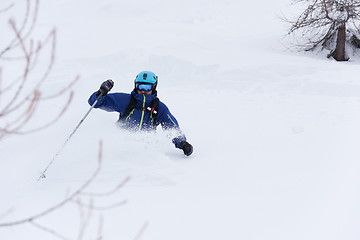 Image showing freeride skier skiing in deep powder snow