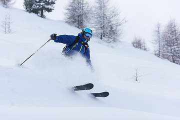 Image showing freeride skier skiing in deep powder snow