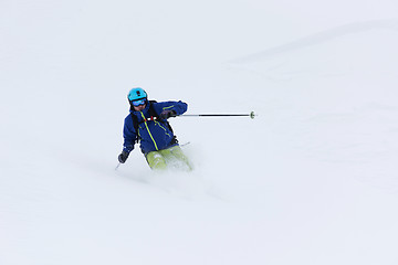 Image showing freeride skier skiing in deep powder snow