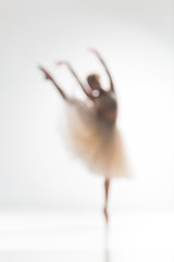 Image showing Blurred silhouette of ballerina on white background