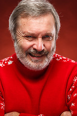 Image showing The expressive portrait on red background of a pouter man 