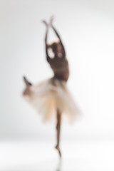 Image showing Blurred silhouette of ballerina on white background