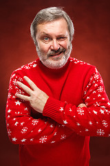 Image showing The expressive portrait on red background of a pouter man 