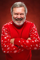 Image showing The expressive portrait on red background of a pouter man 