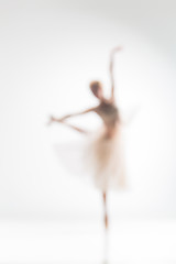 Image showing Blurred silhouette of ballerina on white background